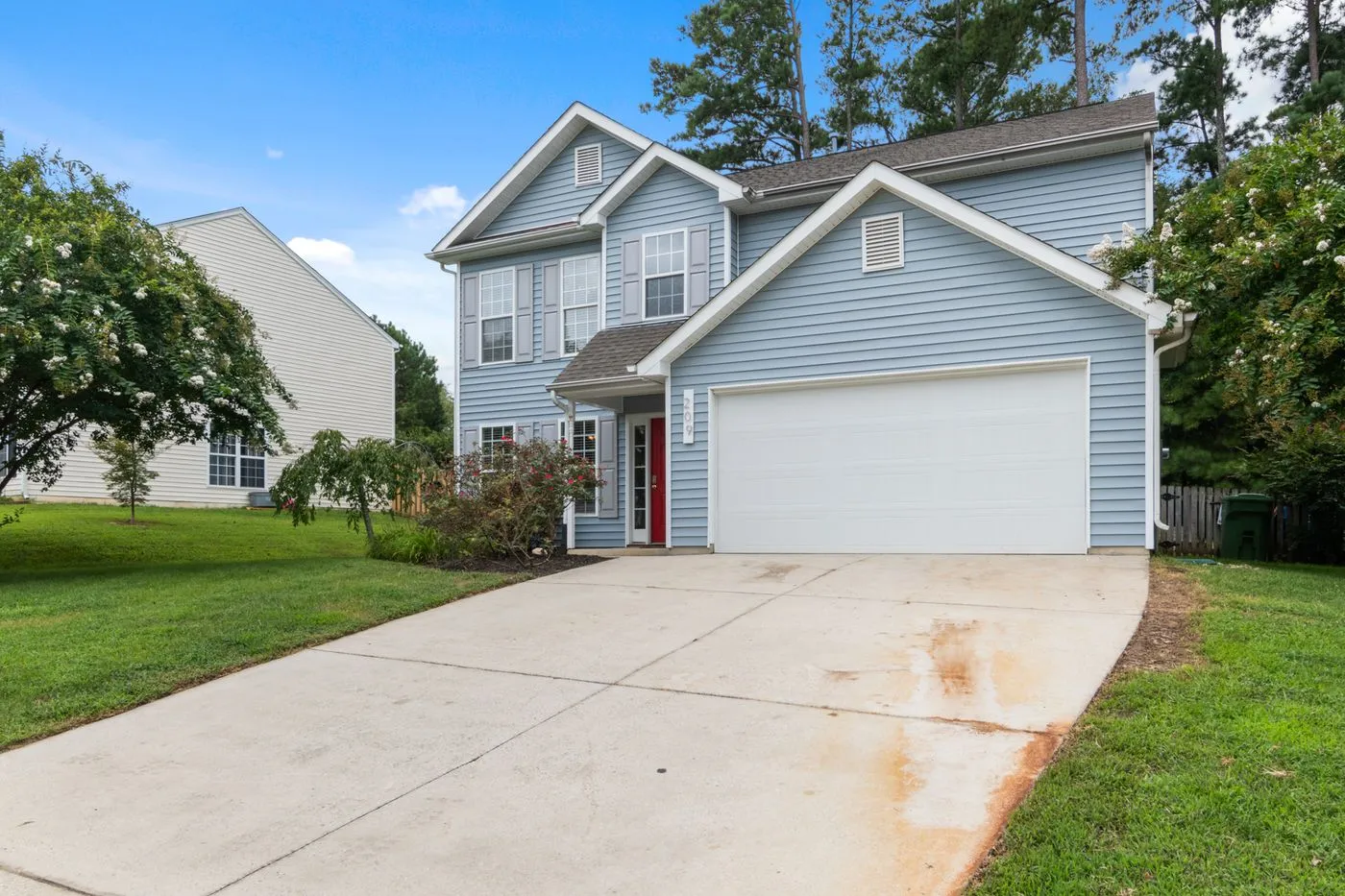 Suburban home exterior after new vinyl siding installation