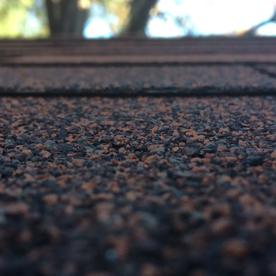 Close-up of asphalt shingle granules showing roofing material texture